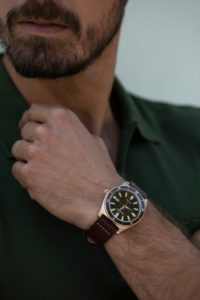 Man wearing a retro watch in brown